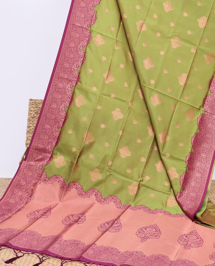 Green butter silk saree with zari buttas, contrast zari border & pallu of intricate zari designs