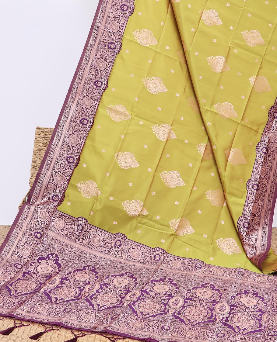 Green butter silk saree with zari buttas, contrast floral creeper design border & pallu of zari intricate designs