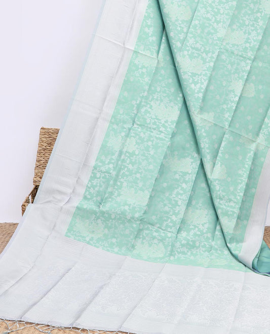 Green floral jacquard butter silk saree, contrast traditional design border & pallu of floral designs
