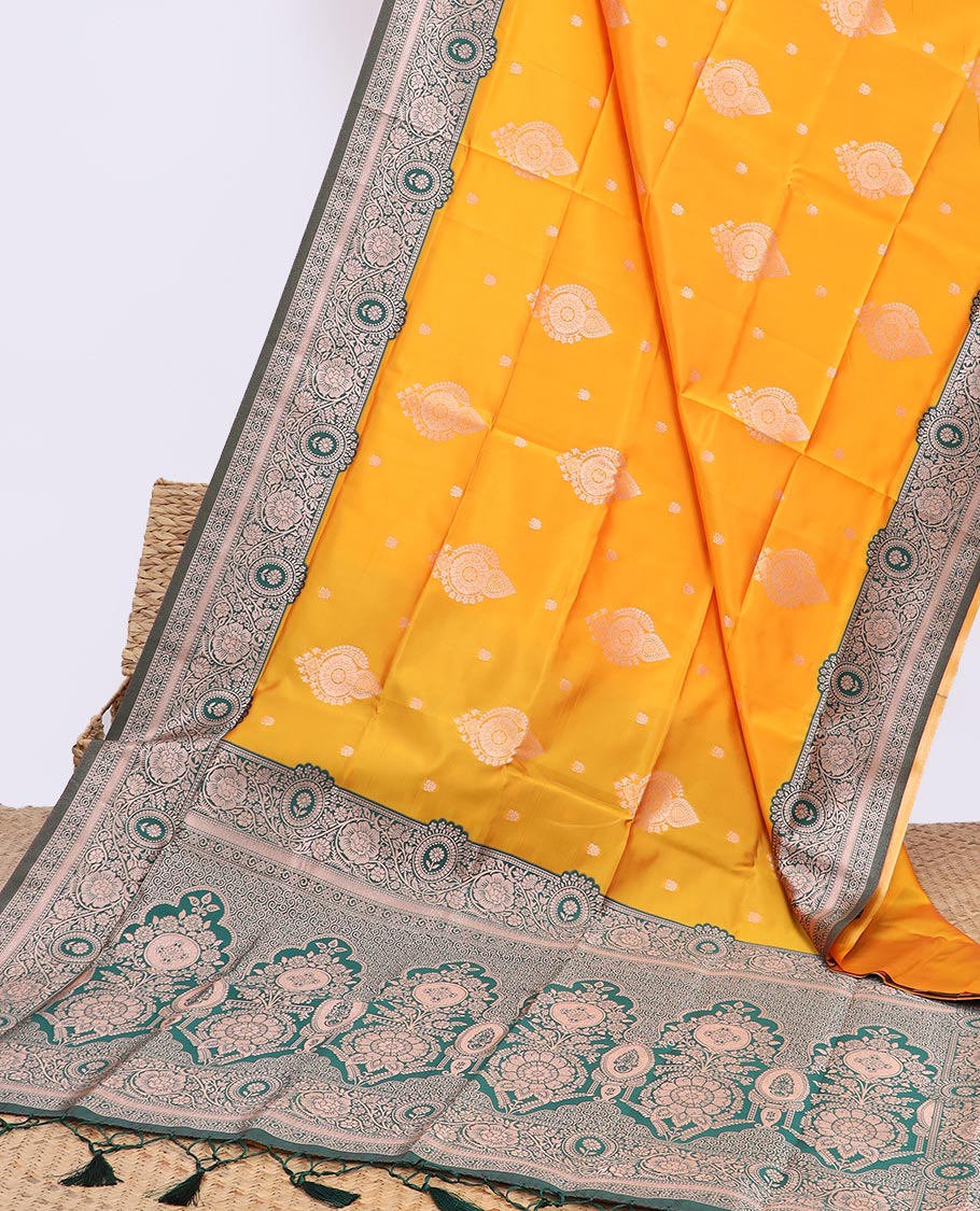 Orange butter silk saree with buttas, contrast floral creeper design border & pallu of intricate designs