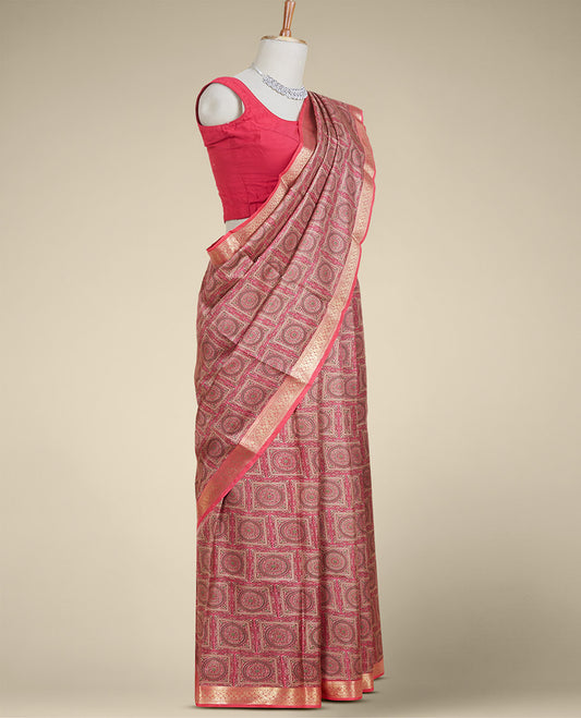 Pink intricately printed silk saree, traditional zari design border