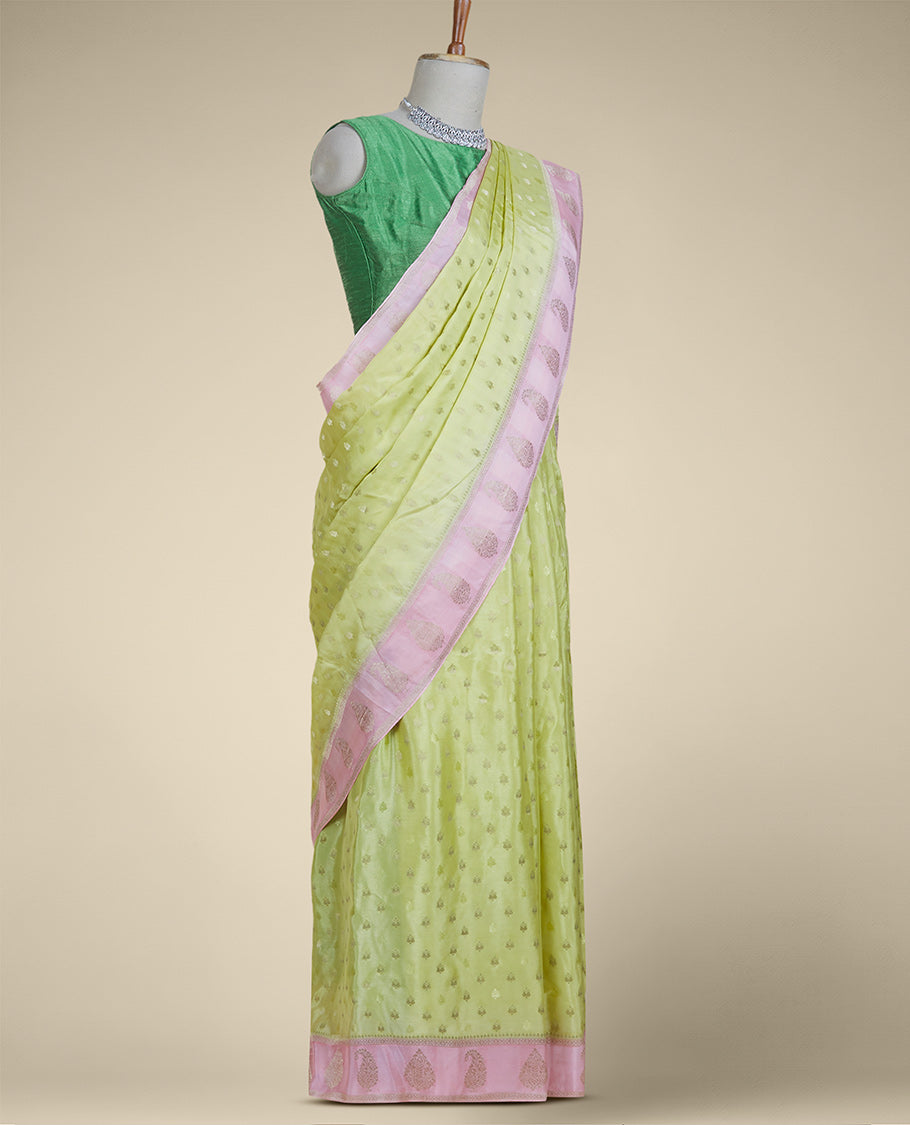Green mysore silk saree with buttas, contrast border features zari paisley designs