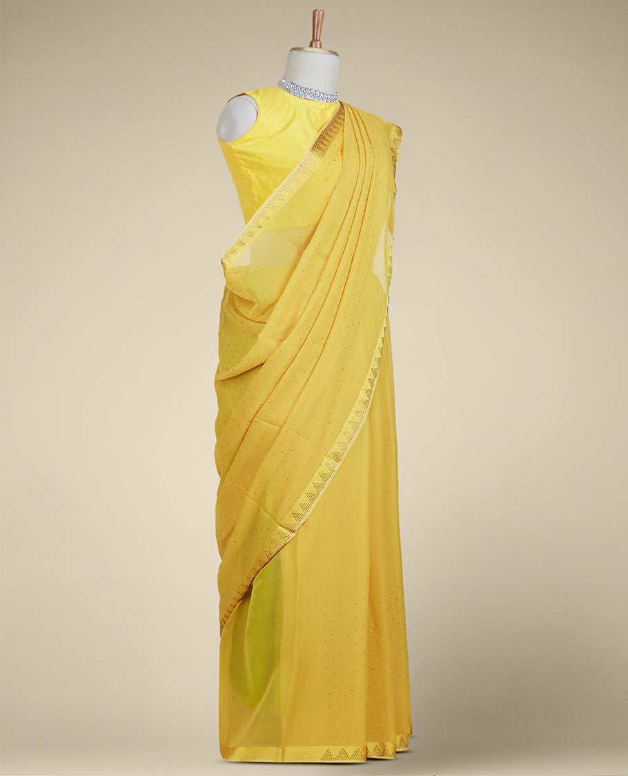 Yellow stone embroidered pure chiffon saree, stone embroidered border