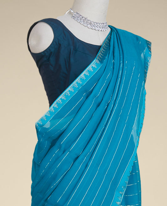 Blue striped pure chiffon saree, stone embroidered border