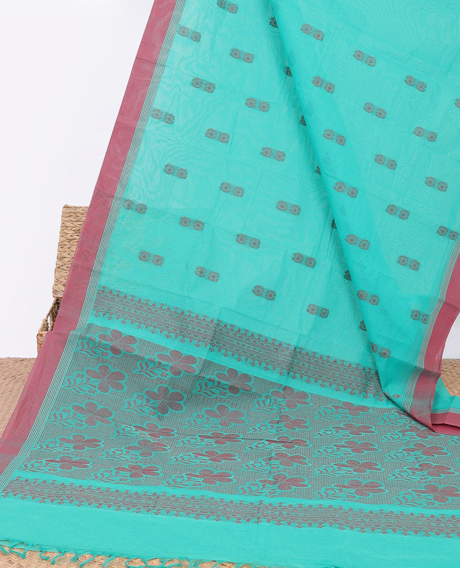 Blue kanchi cotton saree with floral buttas, contrast border & floral design pallu
