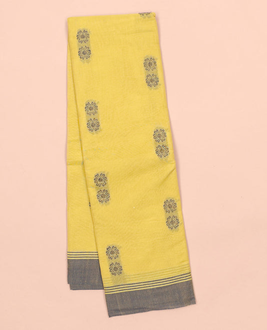 Yellow kanchi cotton saree with floral buttas, contrast border & intricate pallu