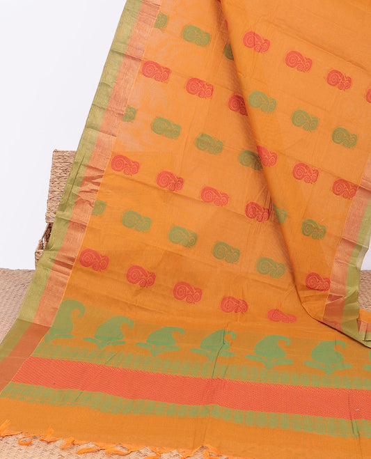 Orange kanchi cotton saree with buttas, contrast plain border & paisley pallu