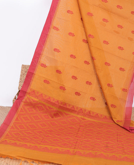 Orange kanchi cotton saree with buttas, contrast plain border & jaal pallu