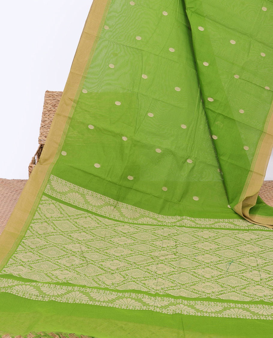 Green kanchi cotton saree with polka dot buttas, contrast border & jaal pallu