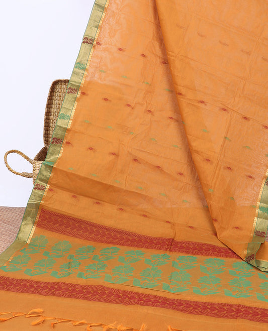 Orange kanchi cotton saree with buttas, contrast floral border & floral design pallu