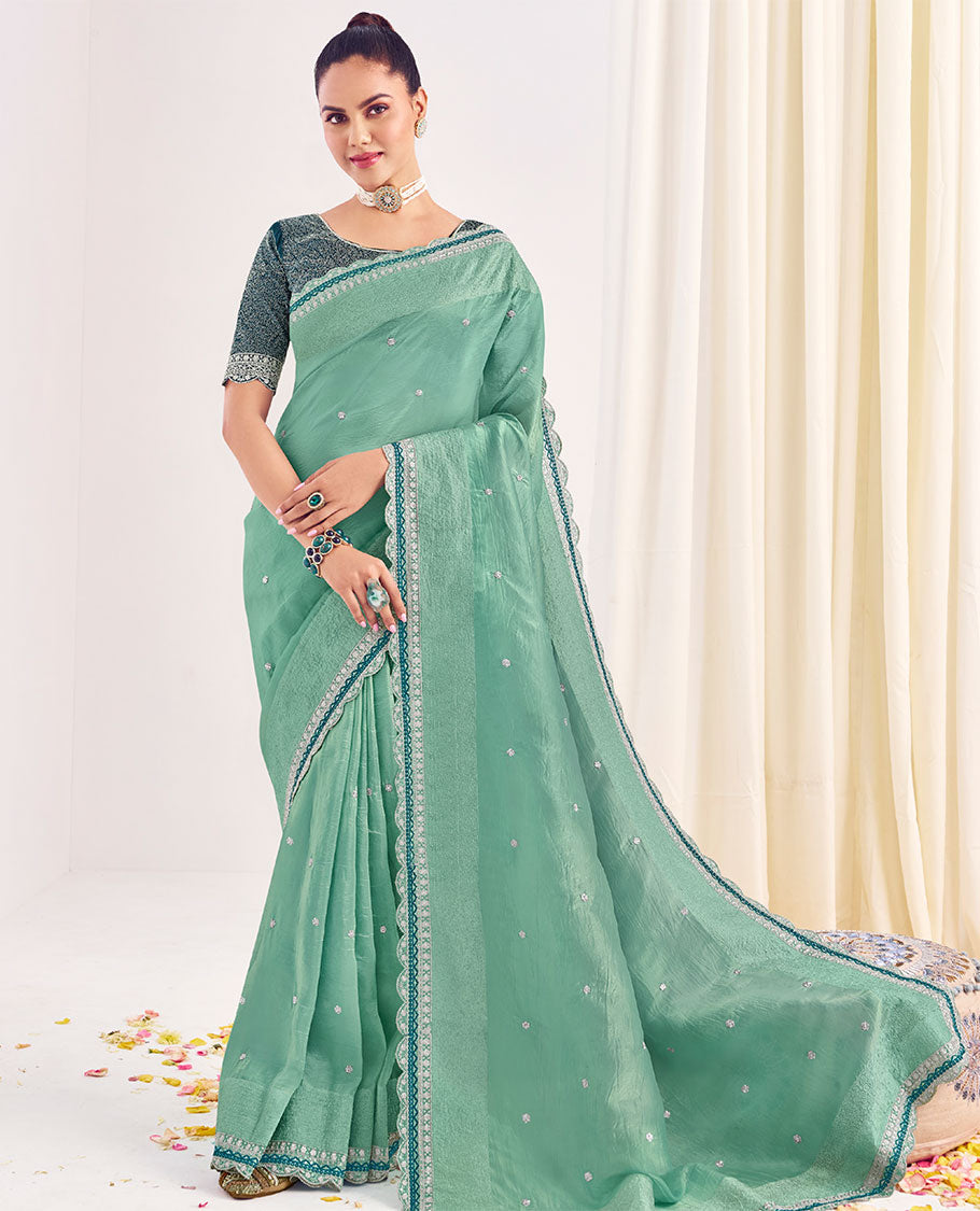 Green embroidered designer catalog saree, scallop embroidered border