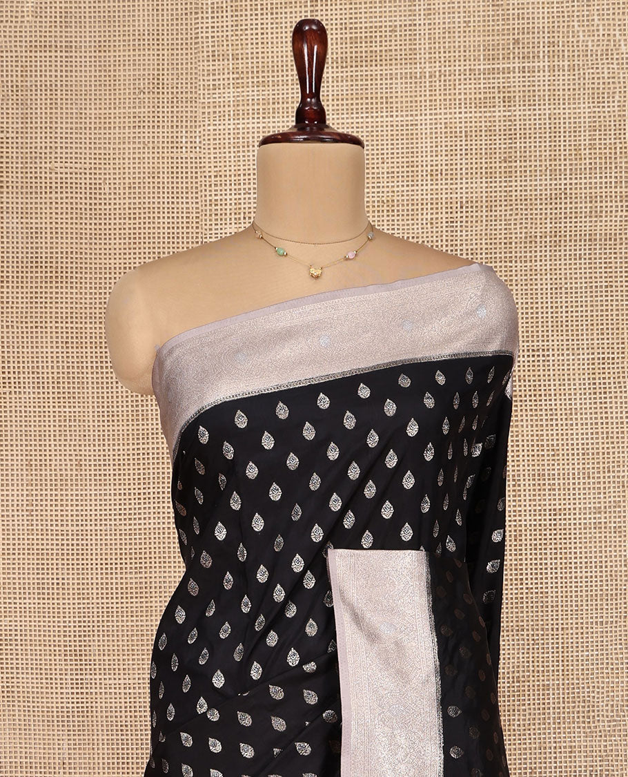 Black Dupion Silk Saree, Beautifully Bedecked with Zari Buttas, Complemented by a Contrast Zari Border, Intricately Designed Pallu, and Has a Contrast Blouse