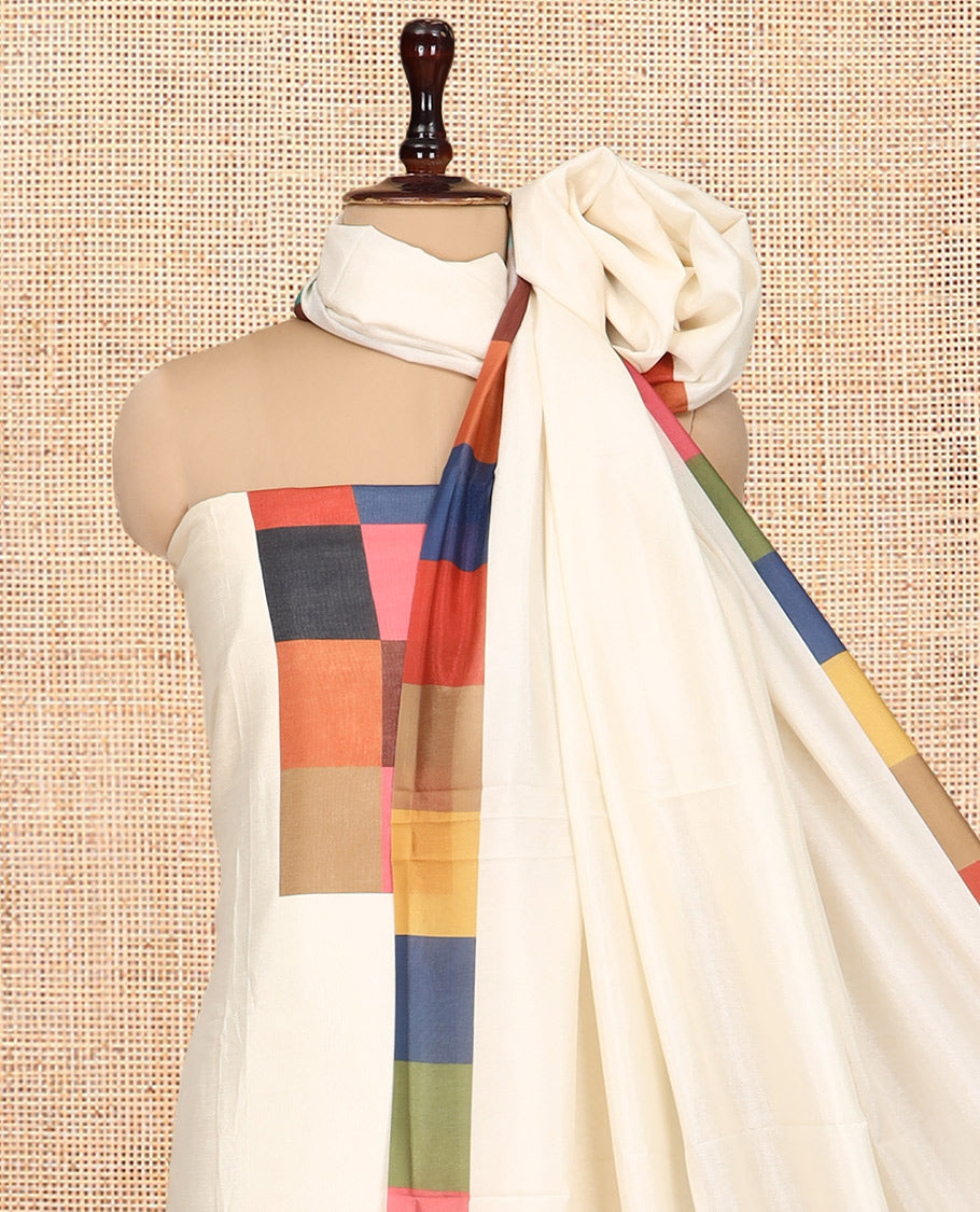 Cream Semi-Silk Material Churidar, Embellished with Multi-Color Checked Top, a Plain Bottom, a Checked Bordered Plain Dupatta