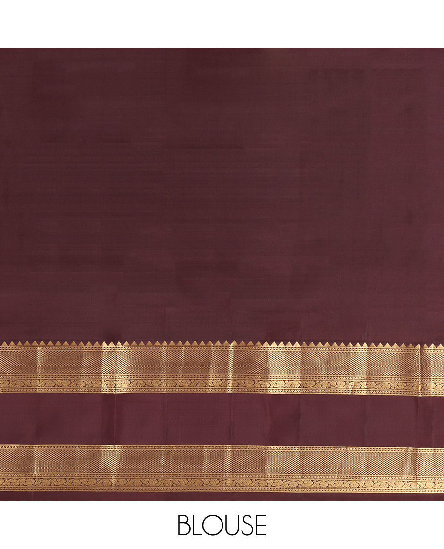 Peach Vasundhara Silk Saree, Accentuated with Zari Buttas and Checks, a Contrast Rettai Pettu Border of Rekku, Neli, Kodi Visiry, and Mayil Kann Designs, Grand Pallu, and a Contrast Blouse