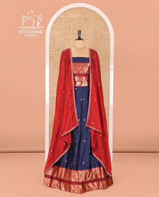 Navy Blue-Red Semi-Banarasi Half-Saree Adorned with Zari Buttas on Its Skirt, Complemented by a Contrast Traditional Zari Temple Rettai Pettu Border, Paired with a Matching Blouse, and a Satin Georgette Embroidered Scallop Dhavani