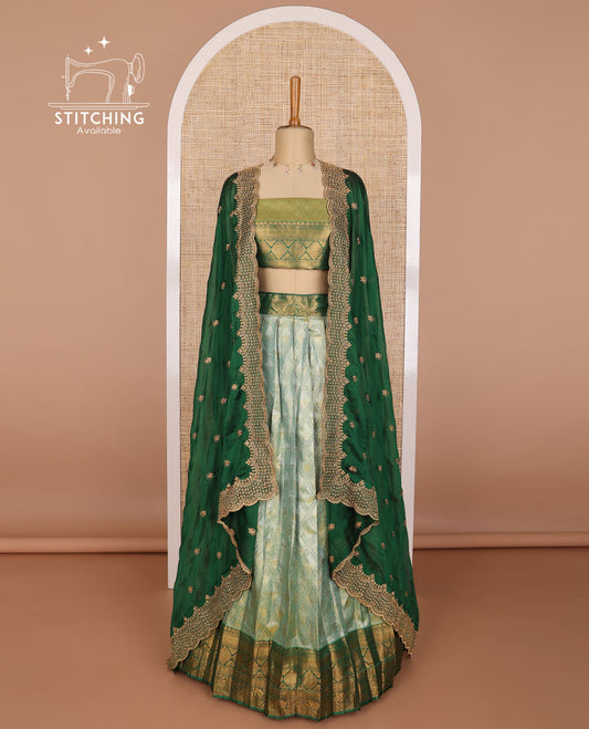 Mint green argyle design banaras half saree with contrast zari design border & zari design blouse & floral embroidered dhavani