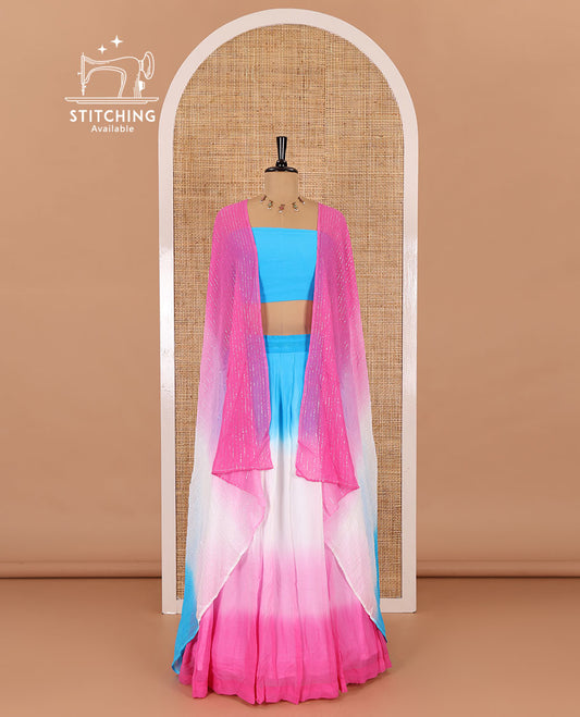 Multi-color half-saree, ombre-colored viscose georgette skirt, a plain sky blue blouse, and a ombre-colored zari striped dhavani
