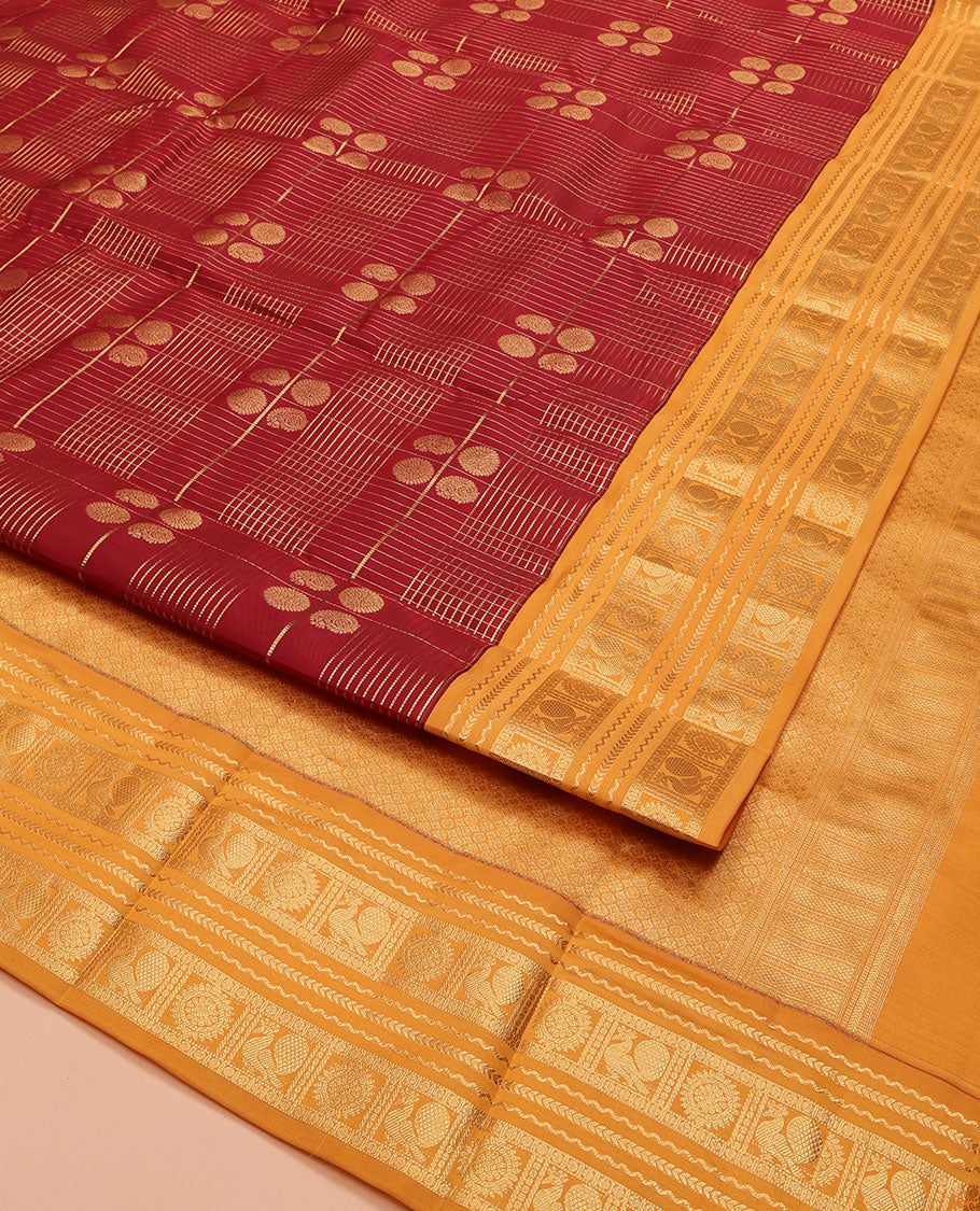 Orange Vasundhara Lite Silk Mix Saree, Majestically Detailed with Zari Butta Enclosed Checked Design on Its Body, Complemented by a Contrast Border of Neli, Kathir, Mayil, and Chakram Designs, Intricately Designed Pallu, and Paired with a Contrast Blouse