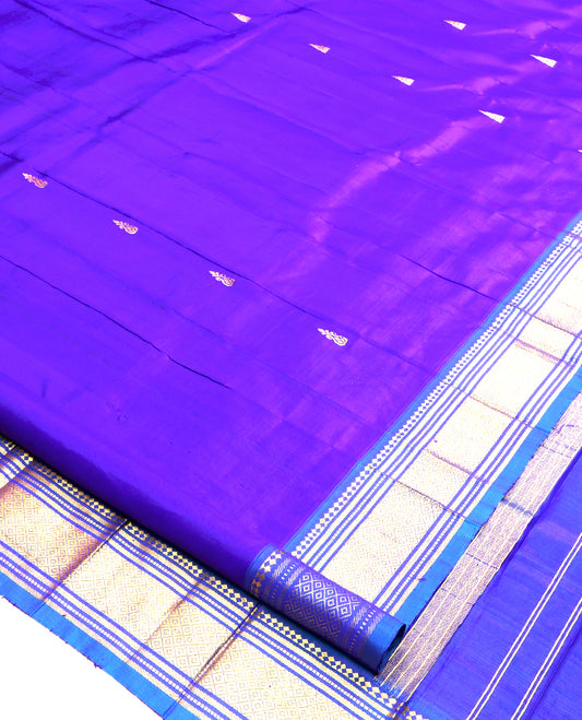 Violet Kanchipuram Silk Saree, Embellished with Zari Buttas, a Contrast One-Sided Border of Paneer Sombu, Banaras, Muthu and Mayil Kann Design, Zari Design Pallu, and No Blouse