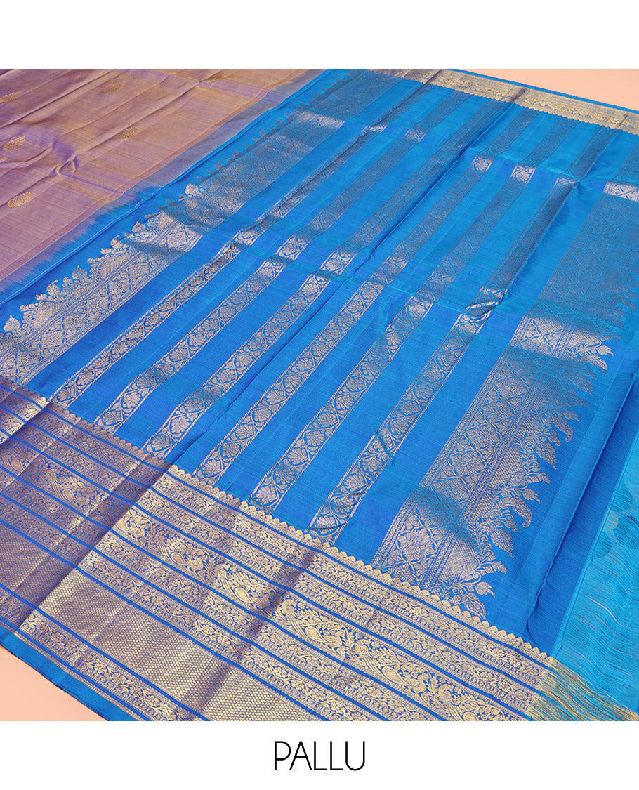 Blue Dual-Tone Kanchipuram Silk Saree, Detailed with Zari Buttas All Over Its Body, Complemented by a Contrast Border of Thilakam Mokku, Kodi Visiry, Mayil, and Kuyil Kann Designs, Grand Pallu of Kodi Visiry Designs, and Paired with a Contrast Blouse