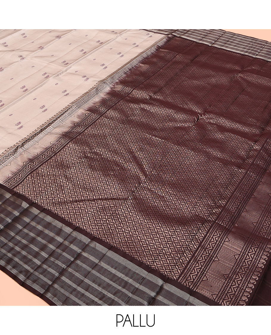 Off-White Kanchipuram Silk Saree, Subtly Sparkled with Buttas and Stripes, Complemented by Contrast Zari Striped Border, Pallu of Intricate Designs, and a Contrast Blouse