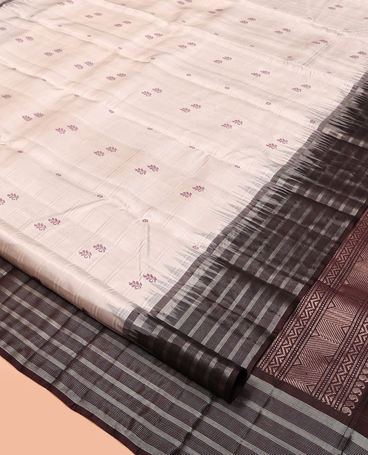 Off-White Kanchipuram Silk Saree, Subtly Sparkled with Buttas and Stripes, Complemented by Contrast Zari Striped Border, Pallu of Intricate Designs, and a Contrast Blouse
