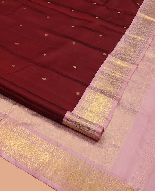 Maroon Vasundhara Silk Saree, Embellished with Zari Buttas All Over Its Body, Complemented by a Contrast Border of Manga, Banaras, Muthu, Neli, and Mayil Designs, Grand Pallu, and Paired with a Contrast Blouse