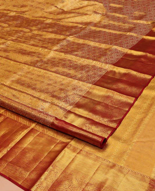 Red Kanchipuram Silk Saree, Opulently Embellished with Zari Jacquard Design All Over Its Body, Highlighted by a Zari Border of Thilakam Mokku, Muthu, Mayil Kann, and Manga Designs, and Pallu of Mughal-Style Designs, and Paired with a Matching Blouse