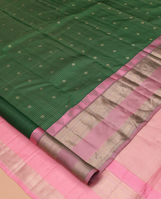 Green Vasundhara Silk Saree, Woven with Zari Buttas and Checks, a Contrast Thazampoo Rekku Border of Chakram Designs, Grand Pallu, and a Contrast Blouse