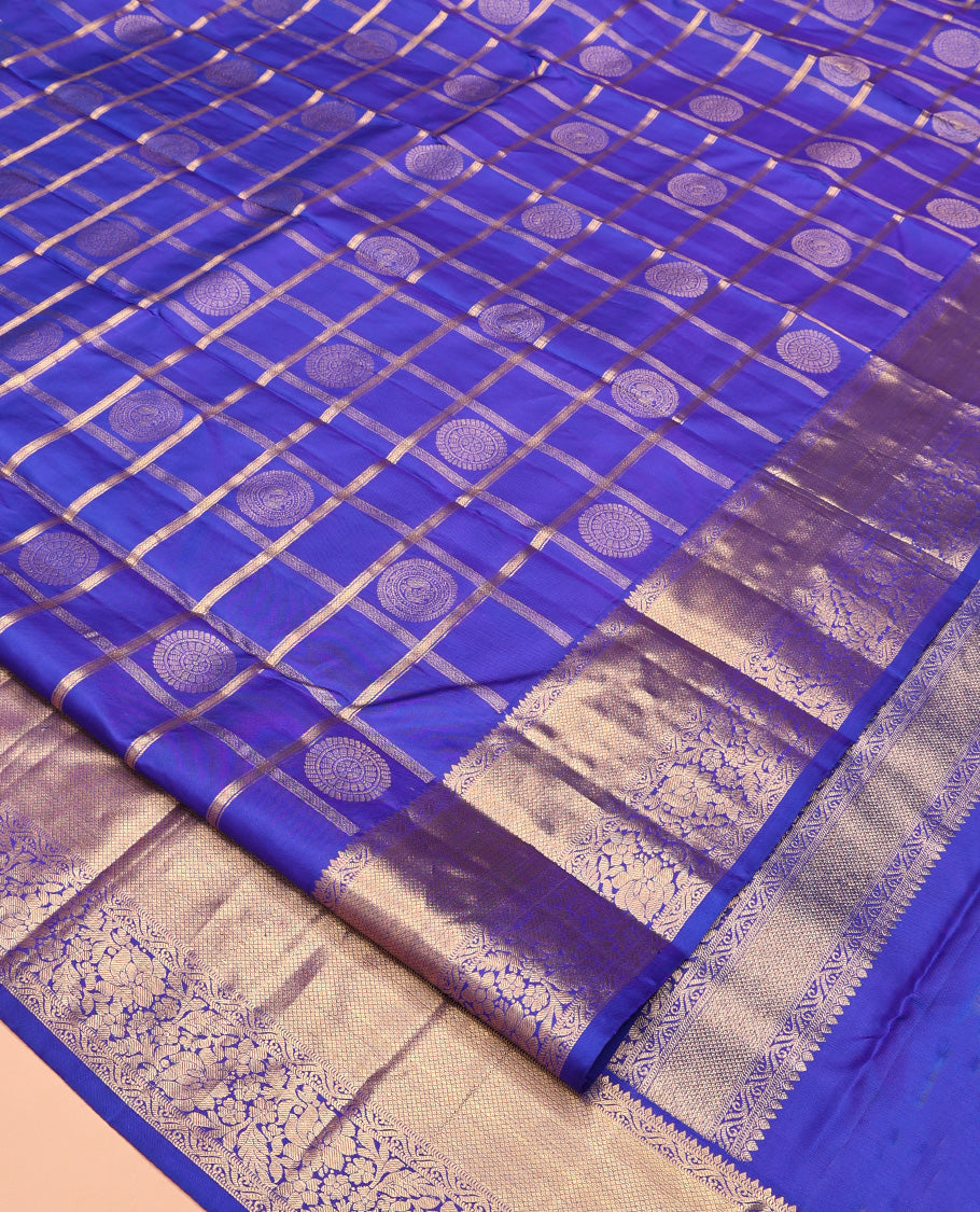 M.s Blue Vasundhara Silk Saree Features Zari Butta Enclosed Checks, a Zari Border of Mayil Kann and Kodi Visiry, Jaal Pallu, and Comes with a Matching Blouse