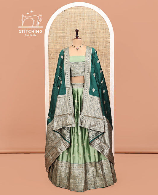 Green Art Silk Half Saree, Accentuated with Buttas Skirt, Contrast Traditional Border, Matching Blouse, and a Contrast Banaras Dhavani