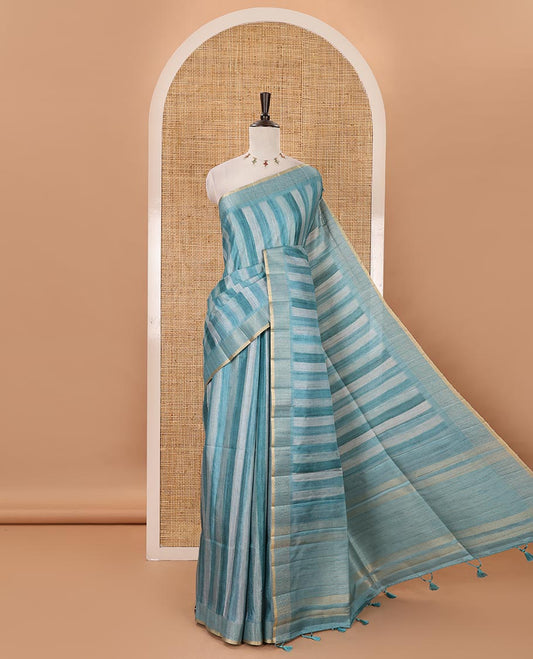 Rama blue hand brushing-style vertical stripes printed fancy tussar silk saree, zig zag-style zari woven border, zari pallu & striped blouse