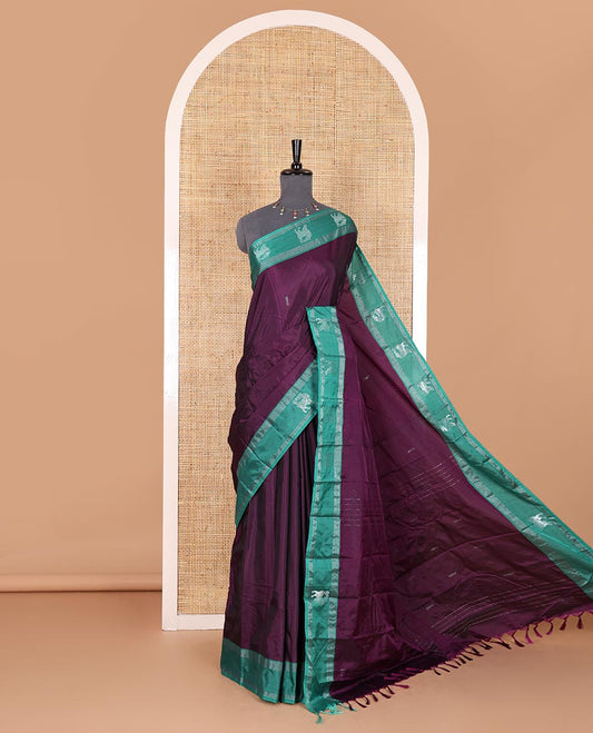 Purple zari buttas Kanchi silk saree, contrast yaali motifs zari green border, zari design pallu, and a matching blouse