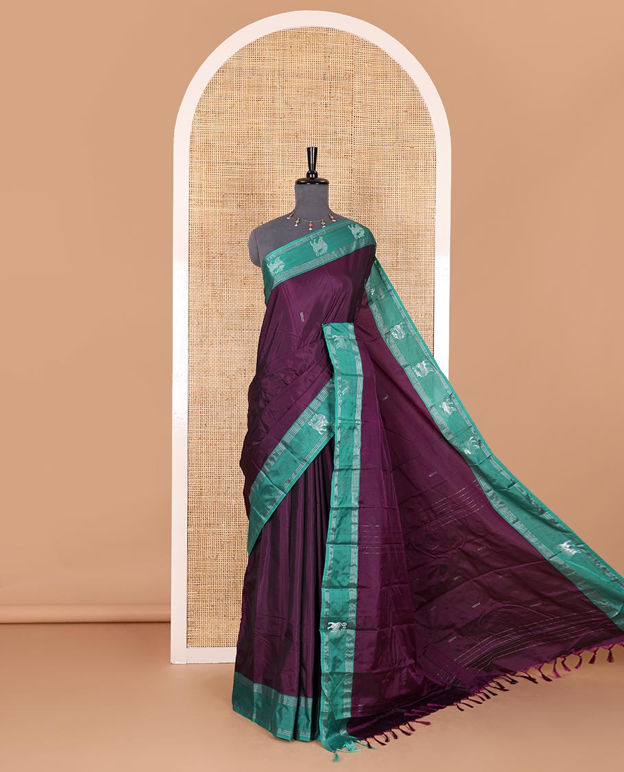 Purple zari buttas Kanchi silk saree, contrast yaali motifs zari green border, zari design pallu, and a matching blouse