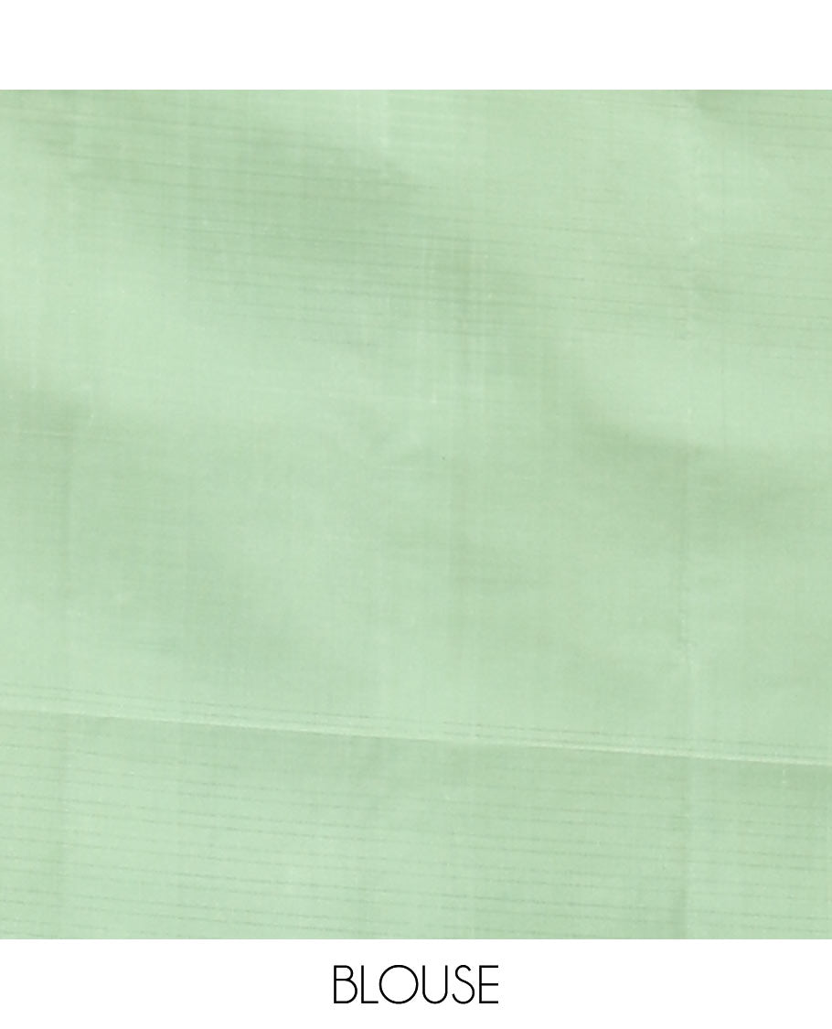 Borderless Green Mayuri Soft Silk Saree, Woven with Buttas All Over Its Body, Sparsely Sparkled Pallu, and Paired with a Matching Blouse
