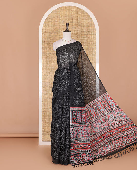 Borderless black bandhani style floral, paisley, and chakra printed semi-jute silk saree, contrast ajrakh printed pallu, and ajrakh printed blouse