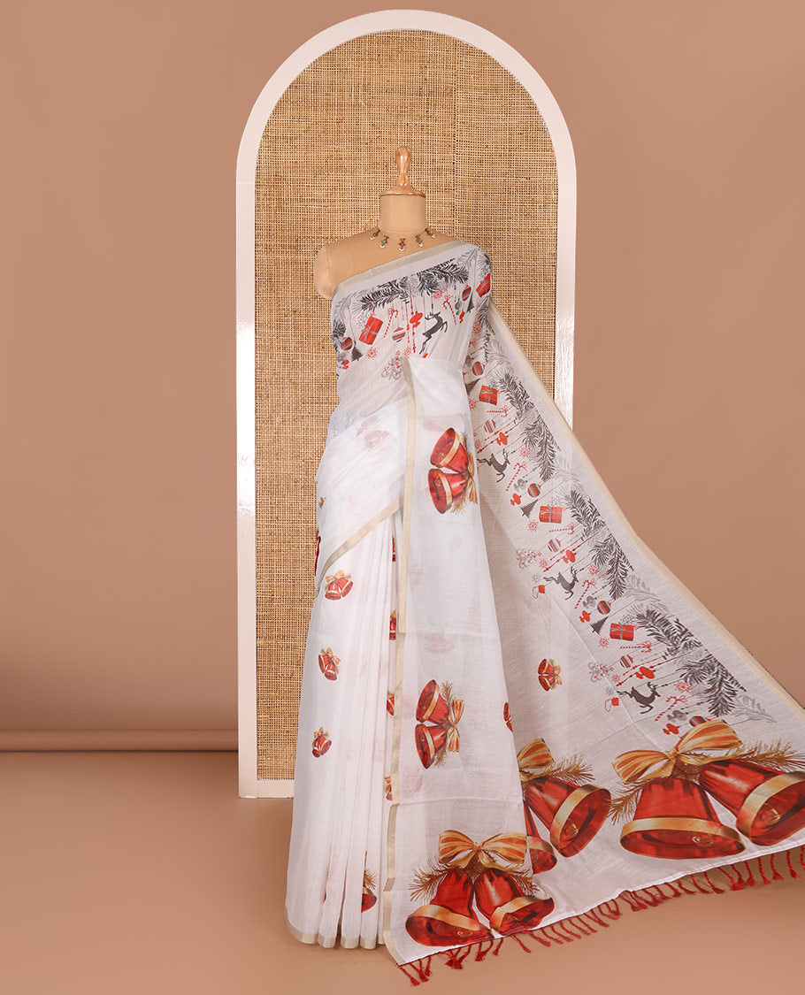 White Christmas-theme digital printed Chanderi cotton saree features bell motifs, piping zari border, big bell printed pallu, and blouse of tiny bell motifs print