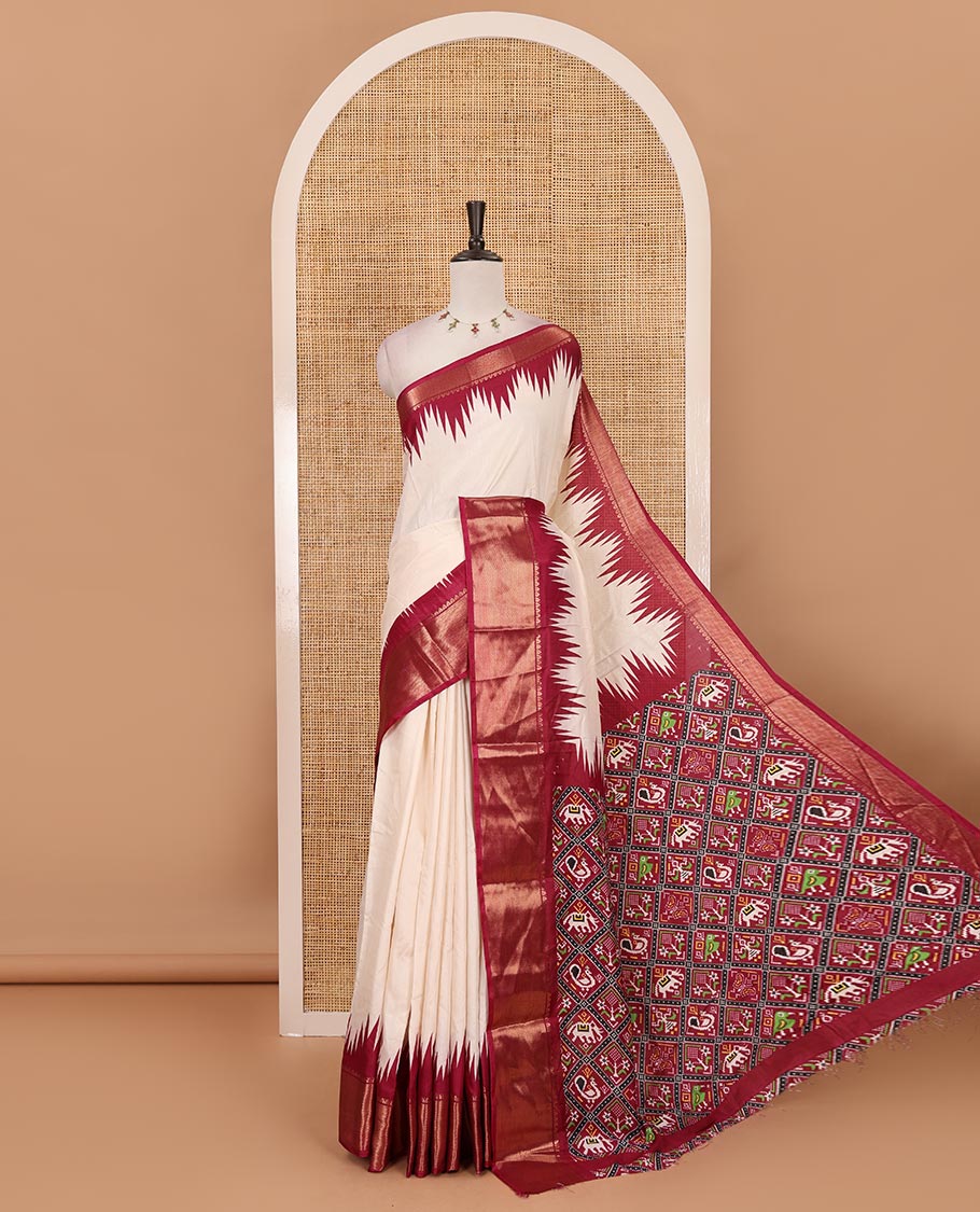 Cream-wine plain dola-tussar saree, contrast temple zari border, patola animal motifs enclosed jaal printed pallu & patola printed blouse