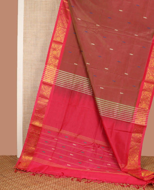 Red Banana Pith Saree, Beautified with Thread Buttas All Over Its Body, Complemented by a Contrast Floral Creeper Design Woven Border, Pallu Steeped with Stripes and Buttas, and Paired with a Contrast Blouse