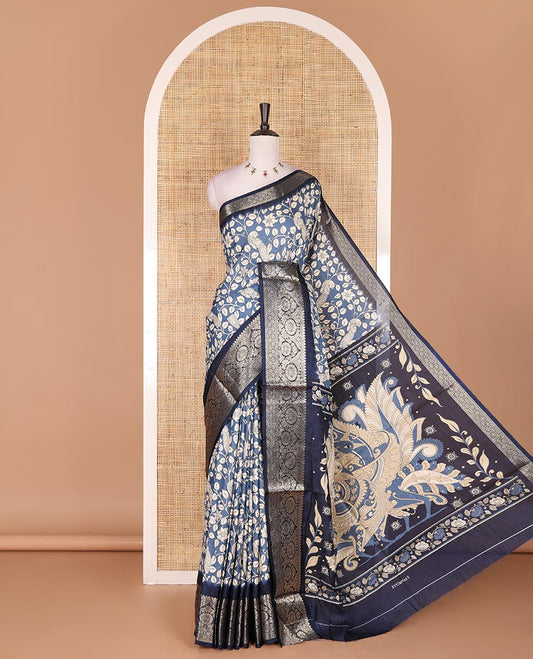 Blue kalamkari floral vine and peacock printed dola silk saree, contrast traditional zari border, peacock printed pallu, and floral vine print blouse