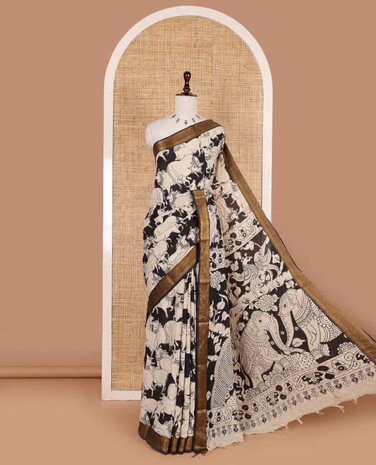 Black and cream pichwai cow printed Mangalagiri silk saree, traditional zari design border, kalamkari printed pallu, and printed blouse