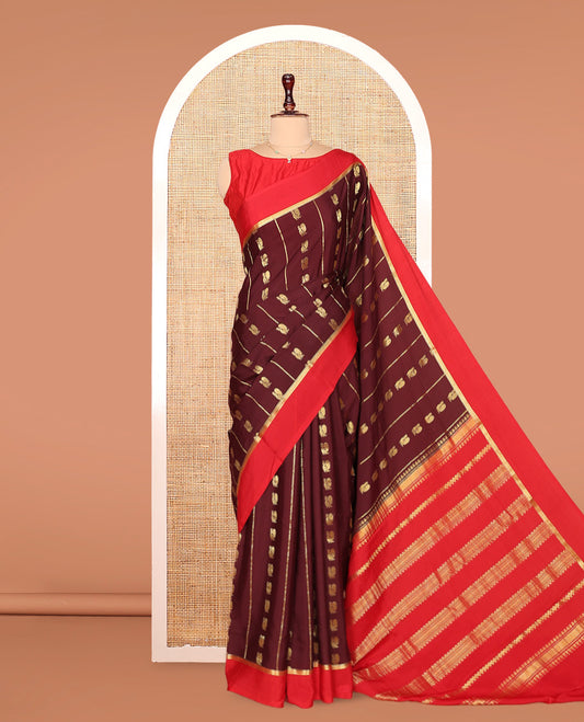 Brown Mysore Silk Saree, Ornamented With Zari Stripes and Peacock Buttas Across Its Body, Complemented by Captivating Contrast Border of Traditional Zari Designs, Pallu Steeped with Traditional Zari Designs, and Paired with a Contrast Blouse