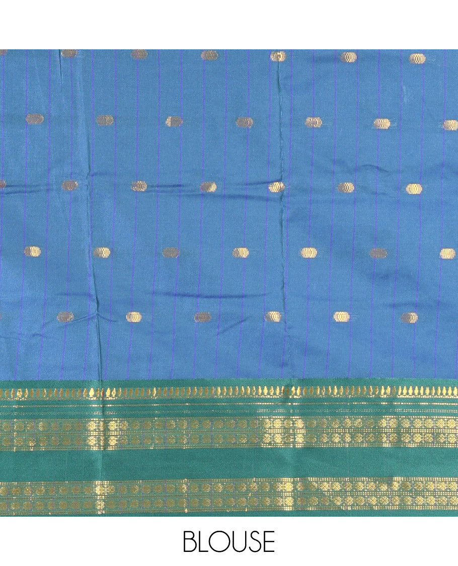 Royal Blue Softy Silk Saree, Accentuated with Zari Buttas All Over Its Body, Complemented by a Contrast Traditional Zari Design Rettai Pettu Border, Pallu Steeped with Buttas, and Paired with a Matching Blouse