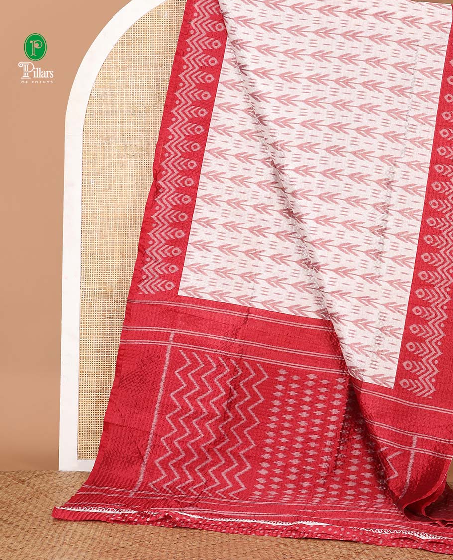 White ikat-style printed Litchi crushed saree, contrast red ikat border, pallu of ikat chevron & dots & ikat printed blouse