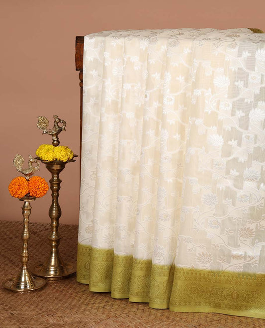 Cream with green thread weaving, zari butta banaras brasso saree with contrast thread border & thread weaving pallu along with butta design blouse