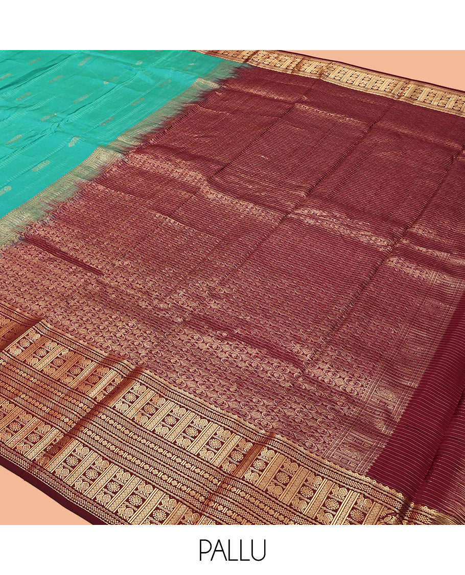 Green Vasundhara Lite Silk Mix Saree, Decked Up with Buttas and Stripes, Complemented by a Contrast Border of Bentex, Mayil Kann, Mayil, and Chakra, Intricate Pallu, and a Contrast Blouse
