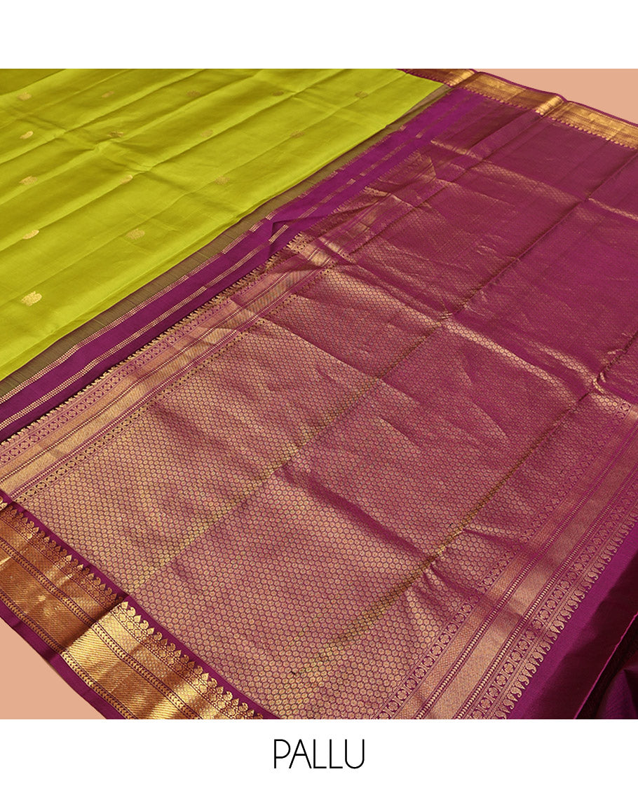 Green Vasundhara Silk Saree, Prettified with Zari Buttas All Over Its Body, Complemented by a Contrast Border of Thilakam, Manga, Muthu, Ara Bogudi, and Mayil Kann Designs, Grand Pallu, and Paired with a Contrast Blouse
