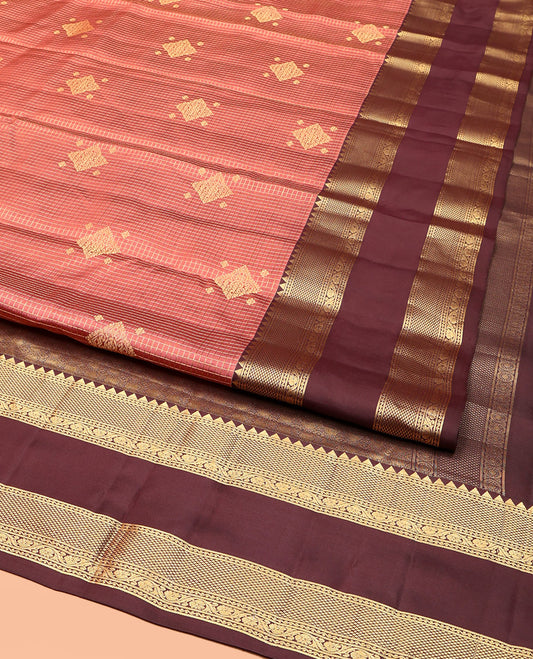 Peach Vasundhara Silk Saree, Accentuated with Zari Buttas and Checks, a Contrast Rettai Pettu Border of Rekku, Neli, Kodi Visiry, and Mayil Kann Designs, Grand Pallu, and a Contrast Blouse