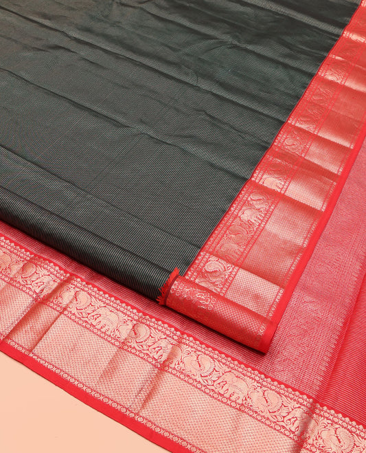 Green Kanchipuram Silk Saree, Bedecked with Stripes All Over Its Body, Complemented by Contrast Border of Mayil, Yaanai, Kamalam, and Mayil Kann Designs, Gleaming Zari-Striped Pallu, and Paired with a Contrast Blouse