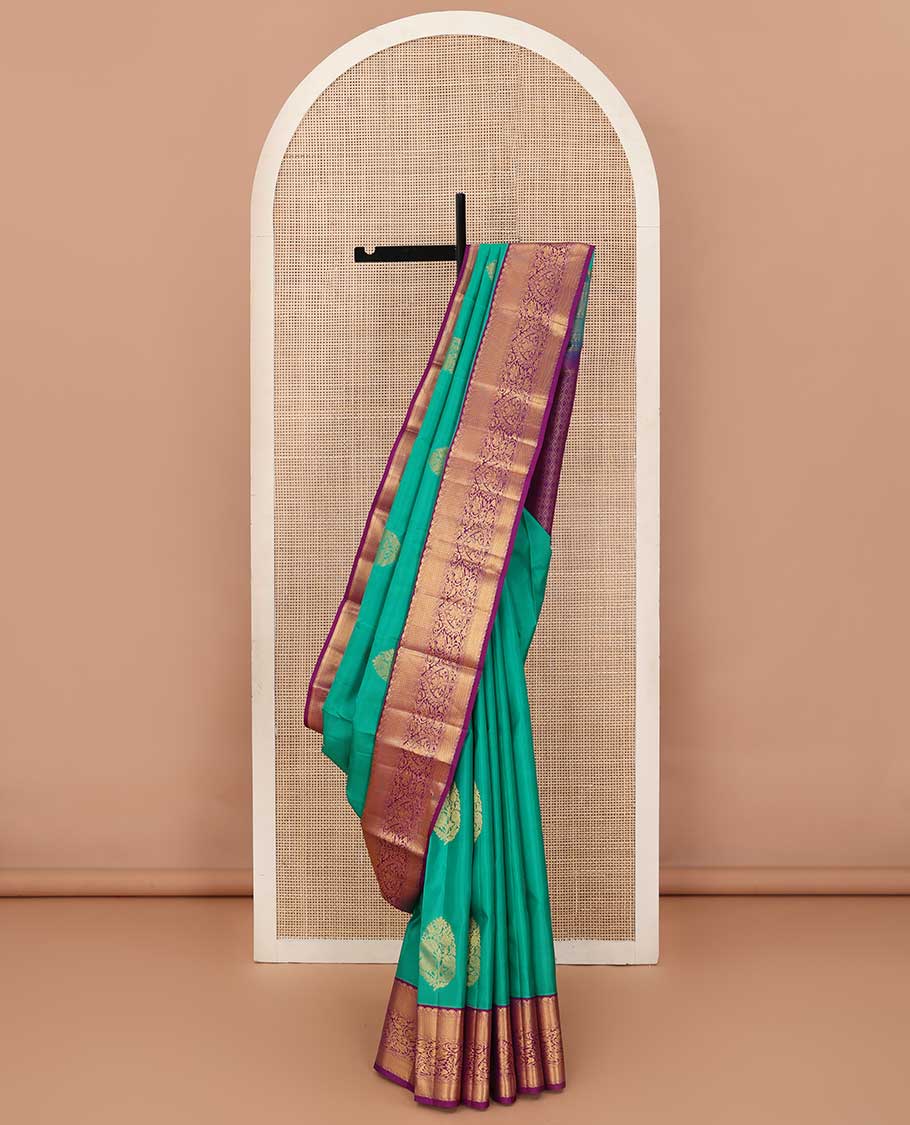 Turquoise blue zari buttas silk saree, contrast border of traditional zari designs, and jaal pallu